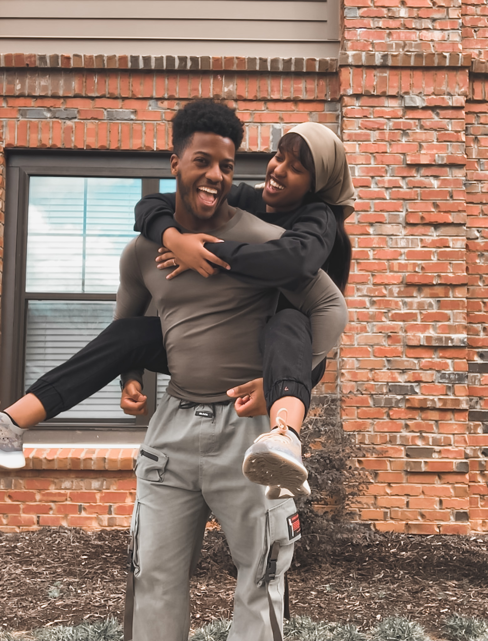 A young couple, laughing and happily in love. 