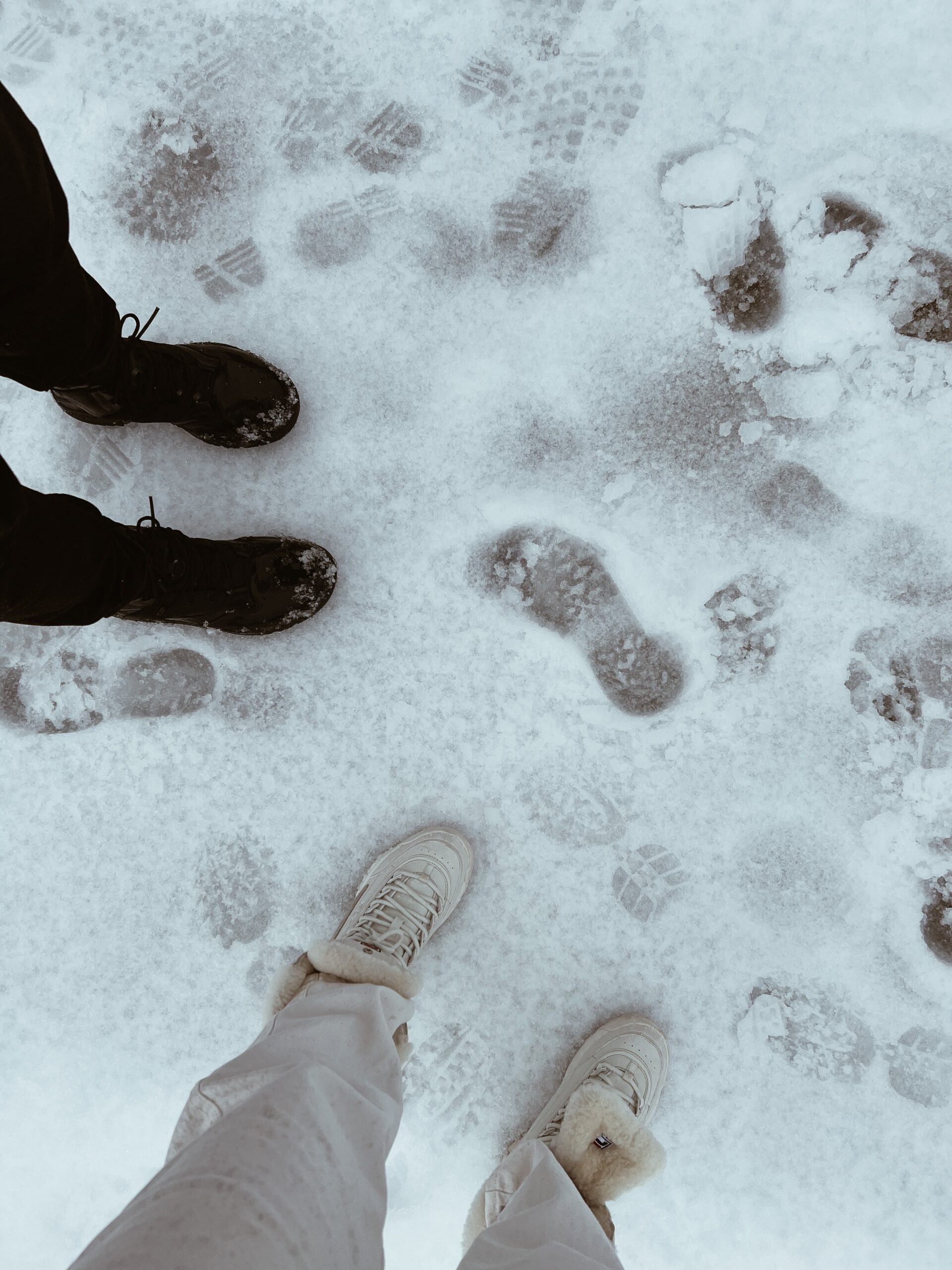 male and female standing in the snow