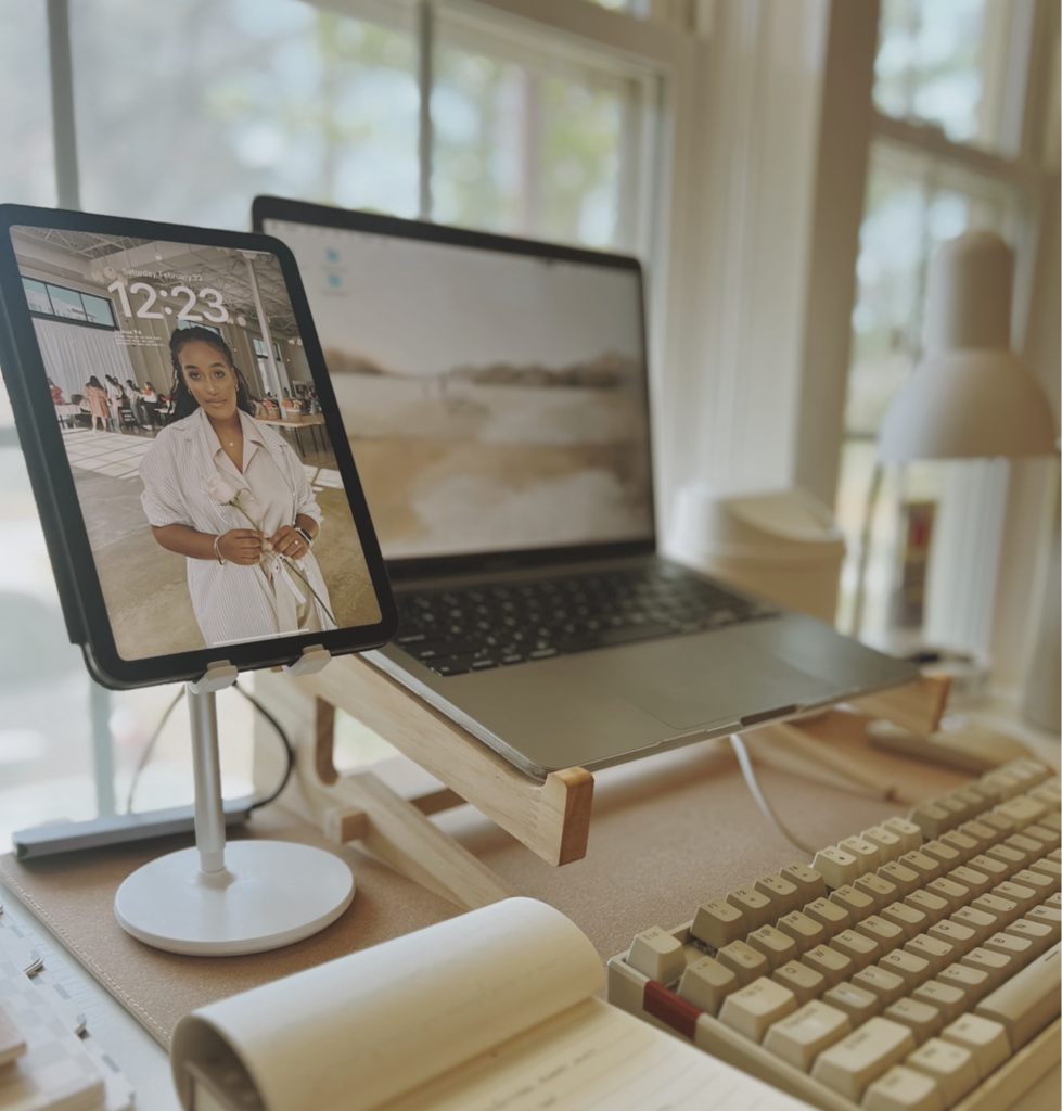Office desk with a laptop, Ipad, Keyboard, Notepad and lamp. 