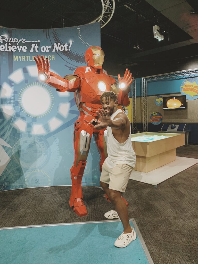 Man standing in front of Iron Man at the Ripley's Believe It or Not 