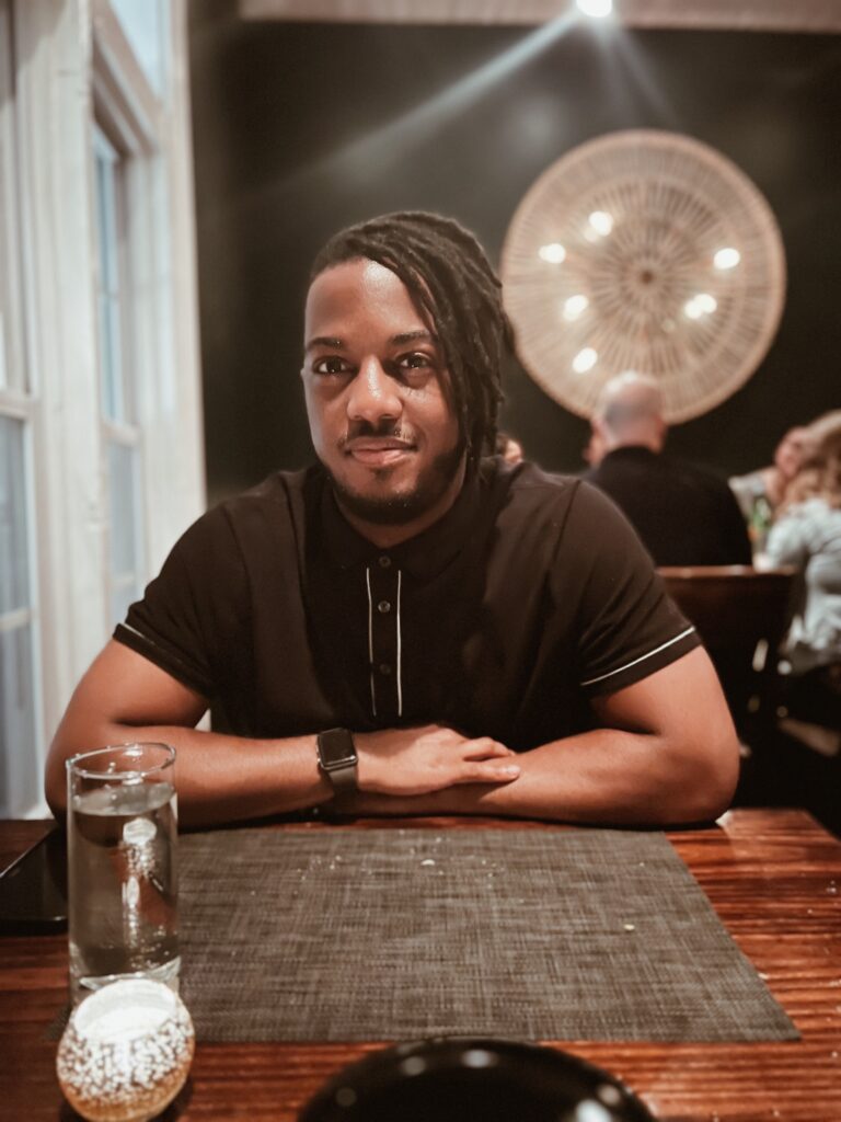 Man sitting at 26 Thai restaurant